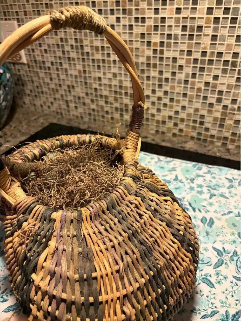 This is a vintage hand-woven double buttocks wicker harvest basket.